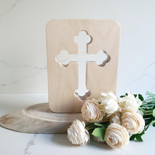 Load image into Gallery viewer, Bring warmth, light, and comfort into your space with our handcrafted Original Cross Night Light – designed to inspire peace, hope, and faith. Each light is made from premium European Beechwood and finished with a safe, water-based varnish.

✔️ Available in Orthodox or Latin styles
✔️ Two sizes to suit every room
✔️ Optional Saint engraving on the bottom corner
✔️ Built-in dimmer for adjustable light
✔️ Choose from plug-in or battery-rechargeable models

The soft glow makes it perfect for a child’s room, pr
